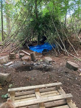 mine wood den and fire pit